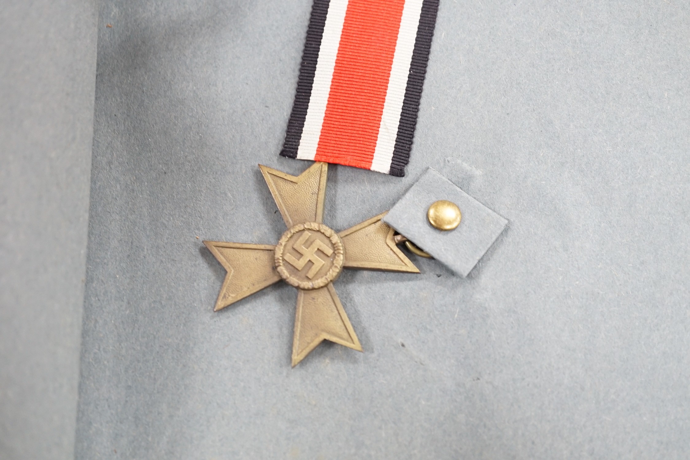 WWII interest album of postcards, printed ephemera and medals relating to Allied expeditionary force, Adolf Hitler headed paper, German medals, Berlin Olympic stadium, banknotes etc.